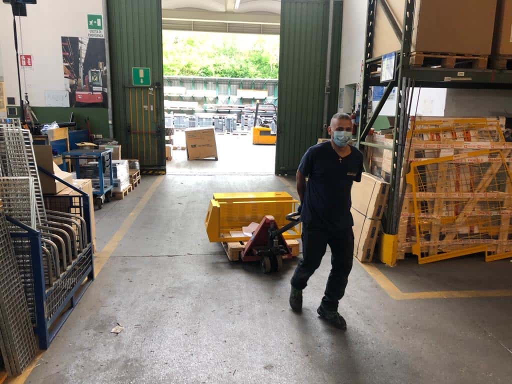 Man pulling a load through warehouse