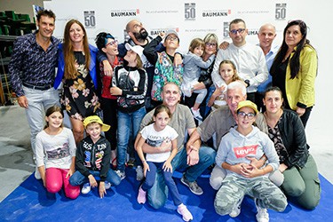 group of Baumann employees and families