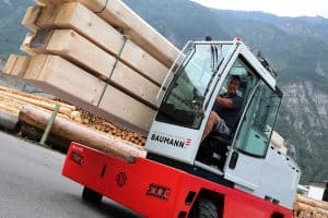 sideloader carrying lumber 