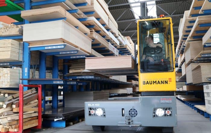 Baumann electric sideloader working in narrow aisle with cantilever racking